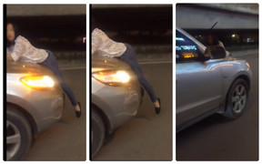 Clip: Người phụ nữ đu bám nắp ca pô ô tô trên phố Hà Nội