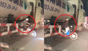 Clip: Hàng loạt xe máy liều chết chui gầm xe bồn để thoát tắc đường