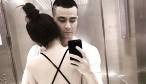 Vĩnh Thụy đăng ảnh ôm cô gái lạ giữa tin chia tay Hoàng Thùy Linh