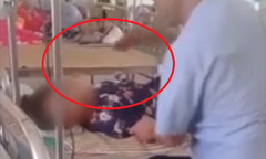 Clip: Vừa giữ tay đang cắm kim truyền, chồng vừa tát bốp vào mặt vợ quát lớn khiến dân mạng phẫn nộ