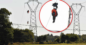 Chiến cơ F-16 rơi, phi công mắc kẹt trên đường điện cao thế