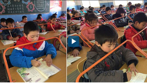 Trường tiểu học ở Trung Quốc lắp giá đỡ giúp học sinh ngồi đúng tư thế