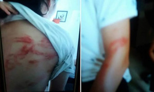 Bố bạo hành 2 con ở Hà Nội: 'Ăn vài cái roi vào mông không có gì là lạ'