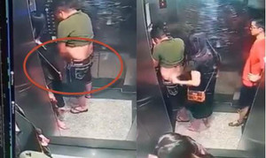 Ghê tởm cảnh người phụ nữ che cho kẻ tè bậy trong thang máy ở TP.HCM