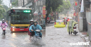 Ảnh: Ô tô phải bật đèn chiếu sáng, người đi xe máy xuống dắt bộ trong trận mưa lớn ở Hà Nội