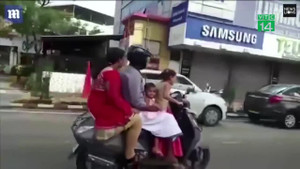 Để con gái 5 tuổi lái xe chở cả nhà, bố bị phạt nặng