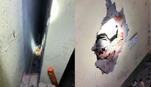 Bé trai vẫn còn dây rốn bị mẹ vứt vào khe tường