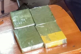 Giấu 4 bánh heroin trong bao gạo mang từ Cao Bằng về Hà Nội