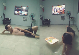 Nhà ngập lụt vẫn nằm khểnh xem tivi, người đàn ông bỗng dưng nổi tiếng