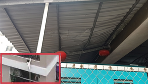 Hình ảnh mái tôn in hằn vết lõm nơi người hùng đỡ bé gái rơi từ tầng 13 chung cư