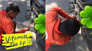 Không ai biết ai, hai tài xế vẫn cắm điện thoại cho tiệm để sửa xe giúp người