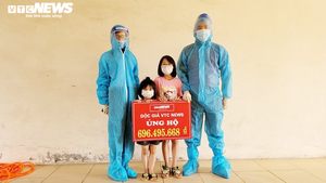 VTC News trao gần 700 triệu ủng hộ của độc giả cho 2 bé chăm nhau ở khu cách ly