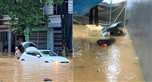 Lào Cai mưa lớn, ô tô chết máy, xe máy ngập gần tới yên