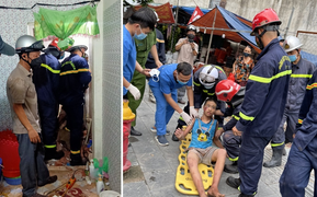 Công an đục tường cứu bé trai mắc kẹt trong khe tường hẹp bằng gang tay