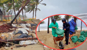 Ảnh: Mưa to, sóng lớn cuộn trào, người dân hối hả 'vá' bờ biển Hội An