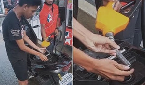 Thanh niên dùng tay vét giọt xăng khiến nhân viên bối rối