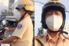 Tài xế ở TP.HCM bị hất rơi điện thoại 2 lần khi ghi hình CSGT