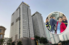 Nghẹt thở giây phút cứu cô gái cầm dao đứng trên nóc chung cư định tự tử