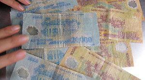 Tiền bị bay màu có còn giá trị sử dụng?