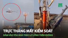 Trực thăng mất kiểm soát tông vào tòa nhà, treo lơ lửng trên không