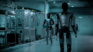 Robot hình người làm việc nhóm nhuần nhuyễn trong nhà máy