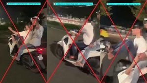 Nam thanh niên lái xe máy bằng chân trên đường phố Đà Nẵng