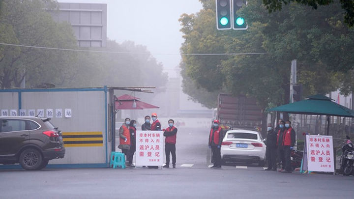 Nhóm chuyên gia WHO tới Bắc Kinh làm việc về Covid-19 - 1