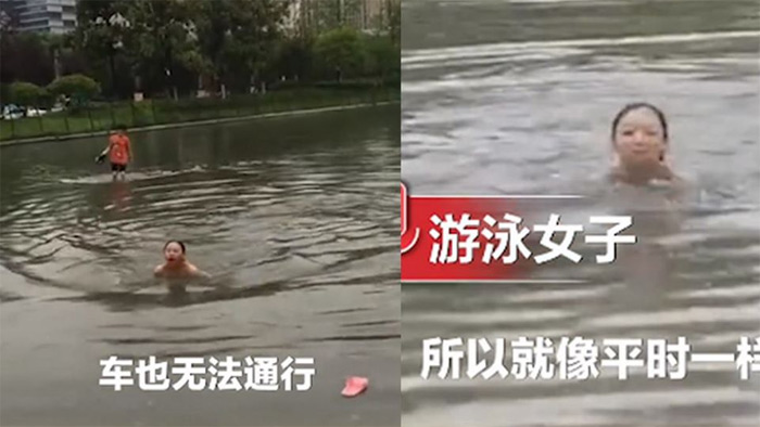 Mưa ngập, cô gái bơi giữa phố để tới chỗ làm khiến dân mạng tranh cãi - 1