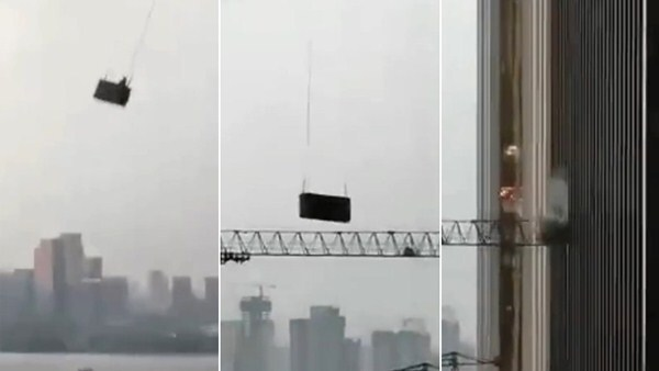 Thót tim cảnh công nhân lau cửa sổ chung cư bị gió mạnh thổi bay - 3