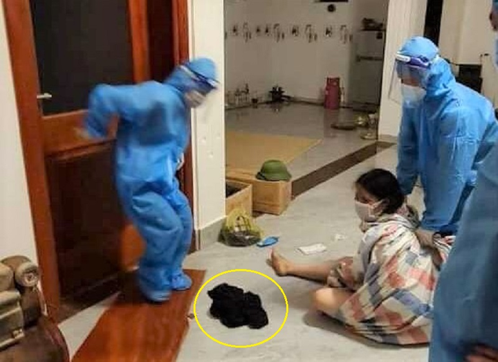 1 phụ nữ F1 cởi quần áo để chống đối việc đưa đi cách ly - 1