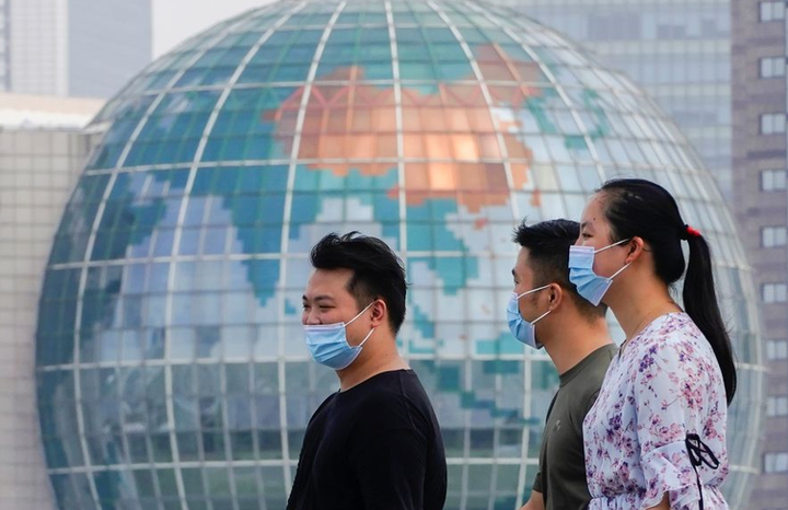 Số ca COVID-19 tại Trung Quốc tăng gấp ba chỉ sau một ngày - 1