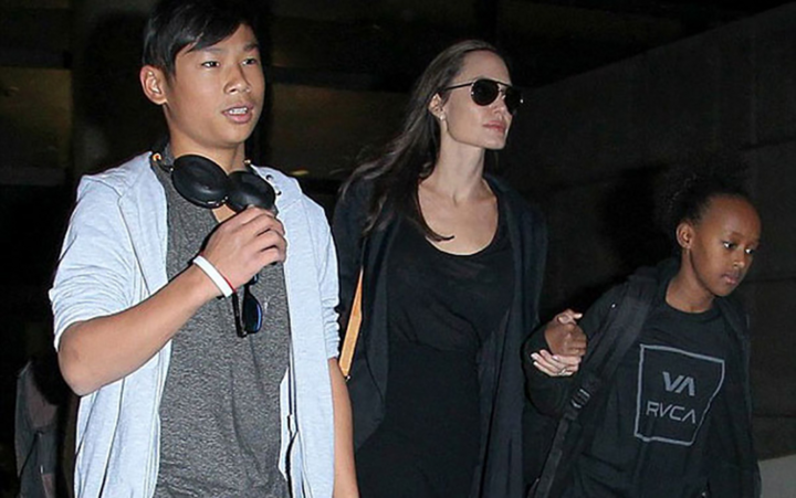 Từ mồ côi thành 'cậu ấm', con trai gốc Việt của Angelina Jolie thay đổi ra sao? - 9