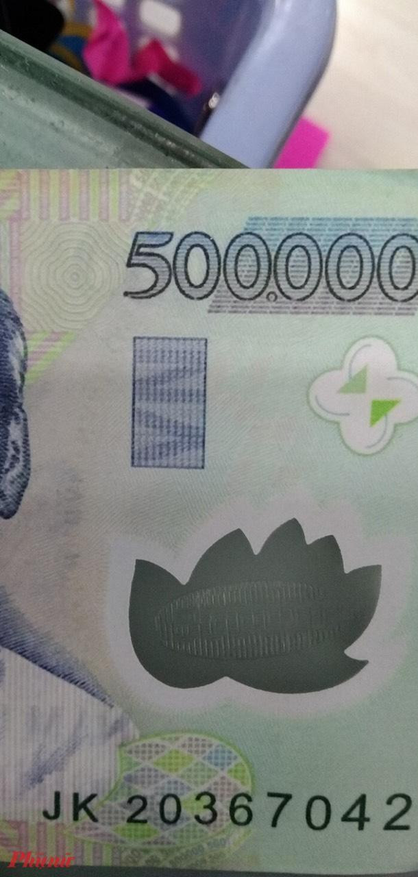 Tiền giả liên tục xuất hiện ở các trung tâm thương mại - 2