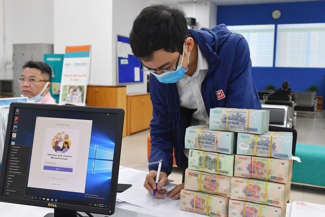 Ngân hàng Nhà nước yêu cầu đẩy nhanh cho vay giảm lãi suất 2%/năm - 1