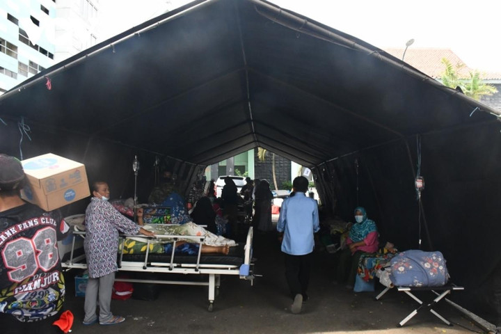 Những hình ảnh thương đau giữa tâm chấn trận động đất ở Indonesia - 13