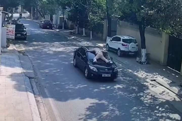 Phó Giám đốc Trung tâm Giáo dục thường xuyên hất CSGT lên nắp capo rồi bỏ chạy - 1