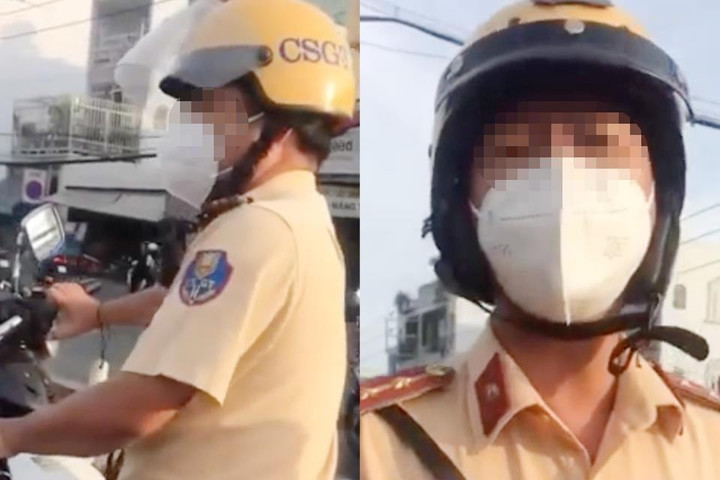 Tài xế ở TP.HCM bị hất rơi điện thoại 2 lần khi ghi hình CSGT - 1