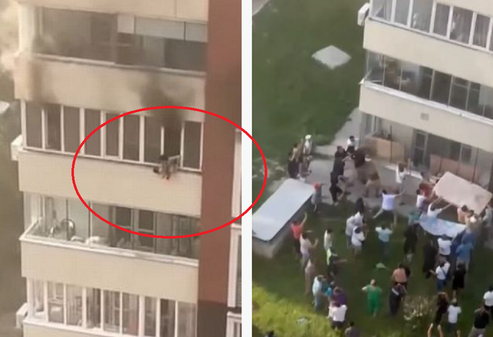 Đứa trẻ được nhìn thấy lủng lẳng ngoài cửa sổ của căn phòng đang cháy, những người ở dưới đứng sẵn, chờ đỡ em bé bằng nệm.