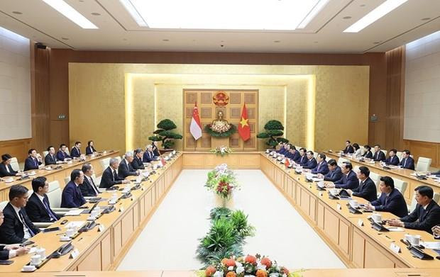 Quang cảnh buổi hội đàm giữa Thủ tướng Phạm Minh Chính và Thủ tướng Singapore Lý Hiển Long. (Ảnh: Dương Giang/TTXVN)