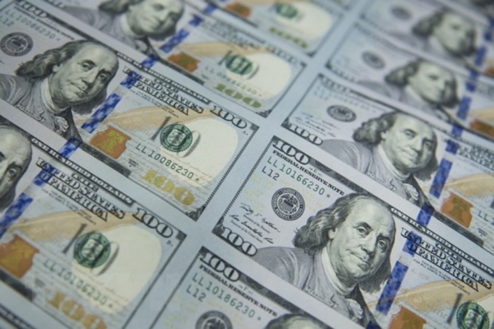 Đồng USD tăng giá gây tác động tới mọi mặt của nền kinh tế. (Ảnh: AFP/TTXVN)