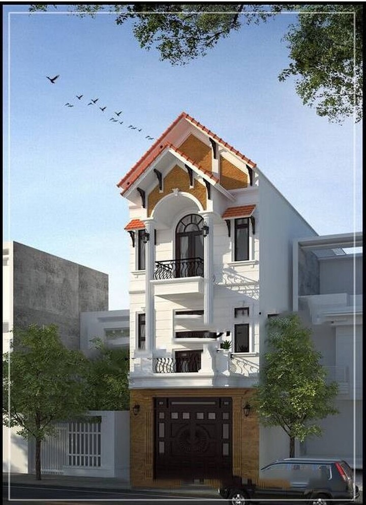 Trái ngược với vẻ đẹp hiện đại, ngôi nhà phố 3 tầng mái ngói đỏ tươi lại nổi bật theo một cách truyền thống rất riêng. Thiết kế không quá cầu kỳ nhưng lại mang lại cảm giác bình dị.