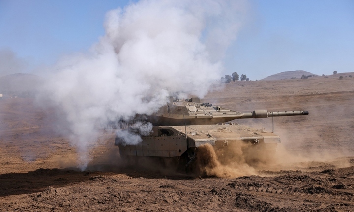 Xe tăng Israel diễn tập trên Cao nguyên Golan ngày 9/11. (Ảnh: AFP)