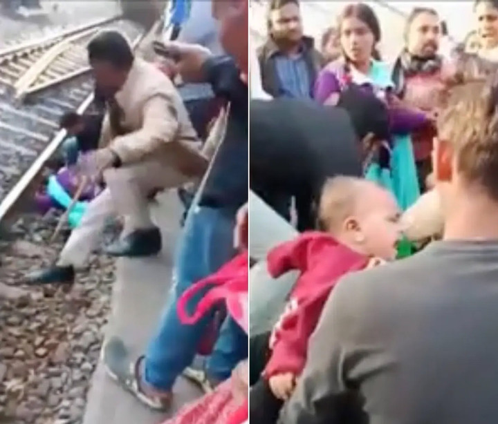 Đám đông xuống đưa ba mẹ con an toàn lên sân ga.