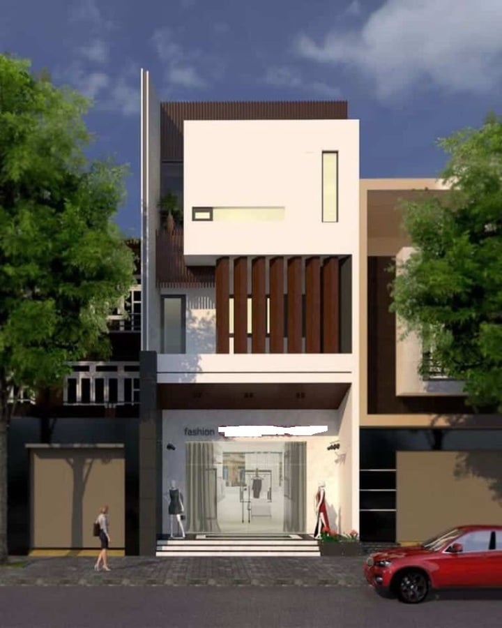 Để tránh sự nhàm chán bởi tông màu trắng của mặt bằng nhà phố kết hợp kinh doanh, những viền sơn đen và các mảng màu nâu được tạo ra làm điểm nhấn thẩm mỹ cho toàn bộ tòa nhà. Hơn nữa, không gian nhà ở còn là một tổ hợp vuông vức với thiết kế hình hộp đầy sáng tạo. (Ảnh: abig.vn)