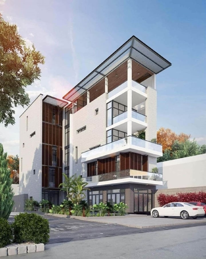 Mẫu nhà phố chữ L kết hợp kinh doanh mang phong cách hiện đại với hệ thống cửa kính cường lực. (Ảnh: Soulconcept)