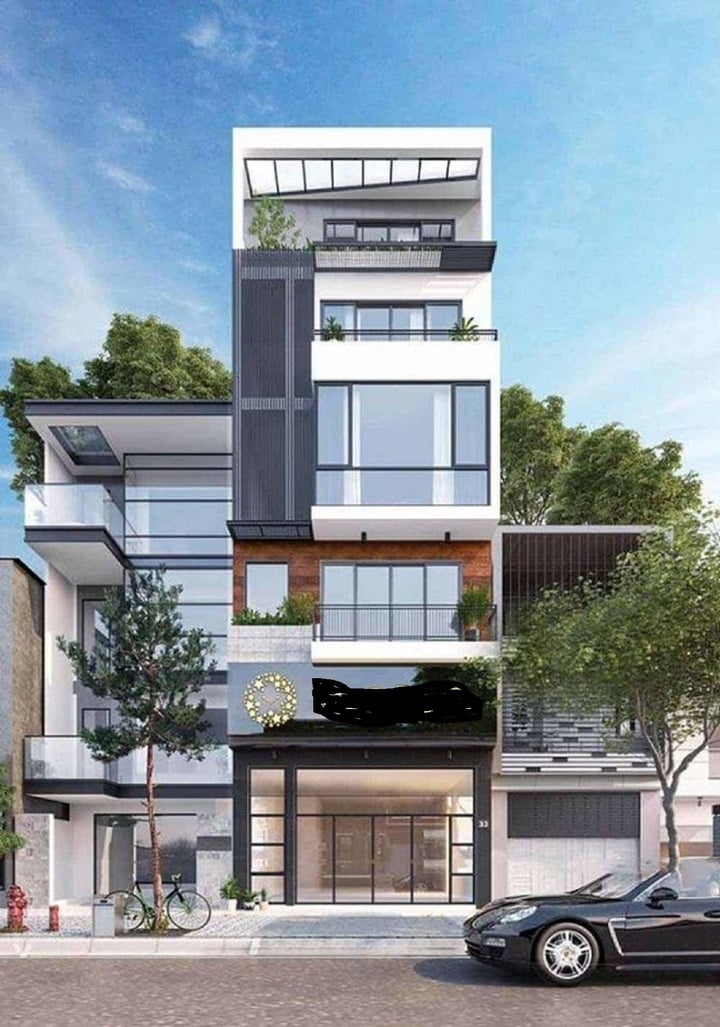 Cửa kịch trần với chất liệu kính trong suốt trong mẫu nhà dưới đây thích hợp dành cho loại hình kinh doanh quán trà sữa, thời trang, quán cafe,... Việc thiết kế mặt tiền đầy ấn tượng chắc chắn sẽ tạo ra sự tò mò đối với mọi khách hàng khi đi qua. Không gian nội thất nhà ở thì thuộc các tầng trên với lối đi riêng cũng tạo được sự riêng tư cần có. (Ảnh: abig.vn)
