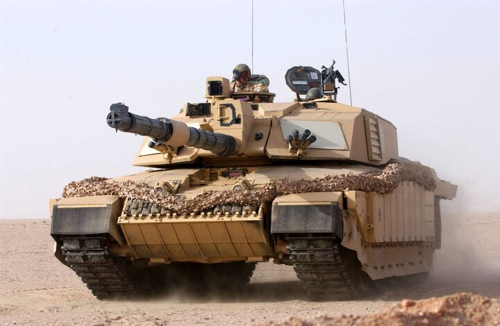 A British Army Challenger 2, part of the 1st Royal Regiment's Fusiliers battle group, in action at Camp Coyote, Kuwait, in 2003.