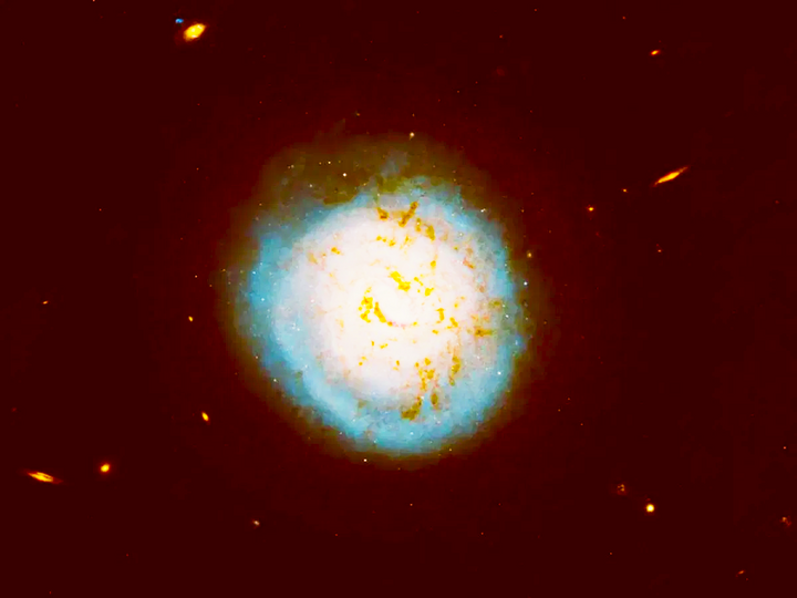 ESO 420-G013 là một thiên hà xoắn ốc với diện mạo như quả bóng chày hoàn hảo, cùng một lỗ đen đang hoạt động thắp sáng phần trung tâm đầy sao của thiên hà. (Ảnh: NASA/Catholic University of America)