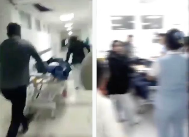 Nhân viên nhà xác đưa cô gái trở lại phòng cấp cứu. (Ảnh: Jam Press)