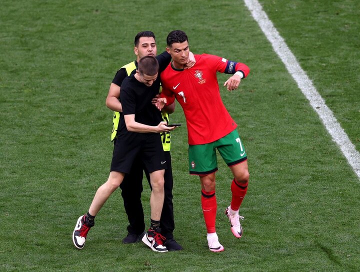 The second fan ran onto the field to take a selfie with Ronaldo